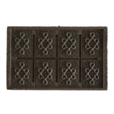 gecomprimeerde Pu Erh thee steen met geometrische patronen en traditionele symbolen