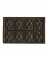 compressed Pu Erh tea brick with geometric patterns and traditional symbols