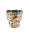 Beige ceramic cup with red splashes and anthracite gray interior