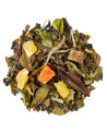 Tè bianco pesca passion con pezzi di frutta secca e foglie di tè verde e bianco