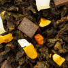 melange van oolong thee met stukjes amandel chocolade en gedroogd fruit