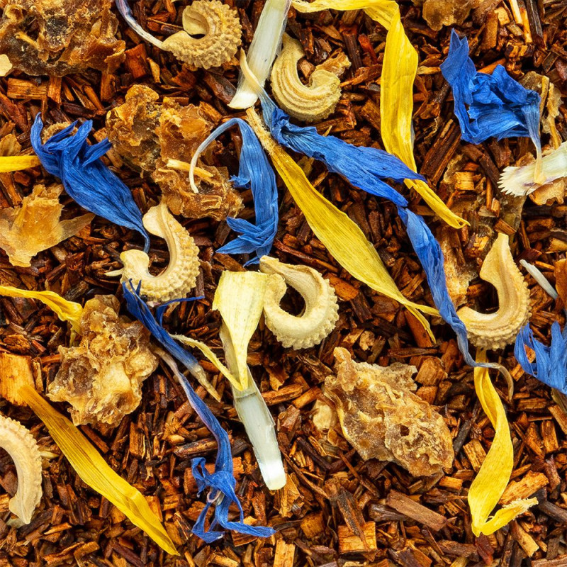 mélange de rooibos citron orange glacé avec pétales de fleurs jaunes et bleues et morceaux d'écorce
