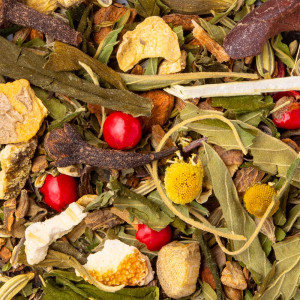 CBD herbal tea blend La Relaxante with leaves, plants, flowers and red berries