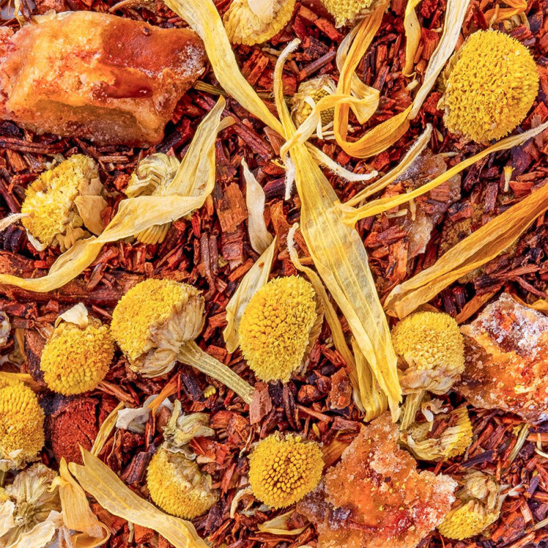Mischung aus Rooibos, gelben Blüten und getrockneten Honigstücken für eine sanfte Honig-Infusion