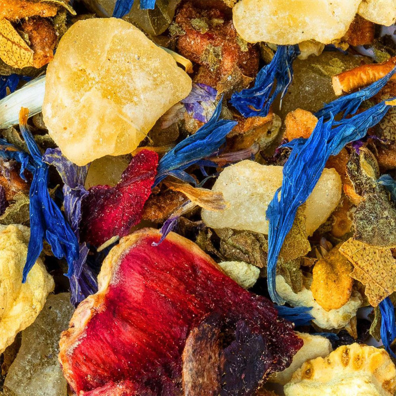 miscela di tisana al melone glassato con pezzi di frutta essiccata, petali di fiori e erbe aromatiche