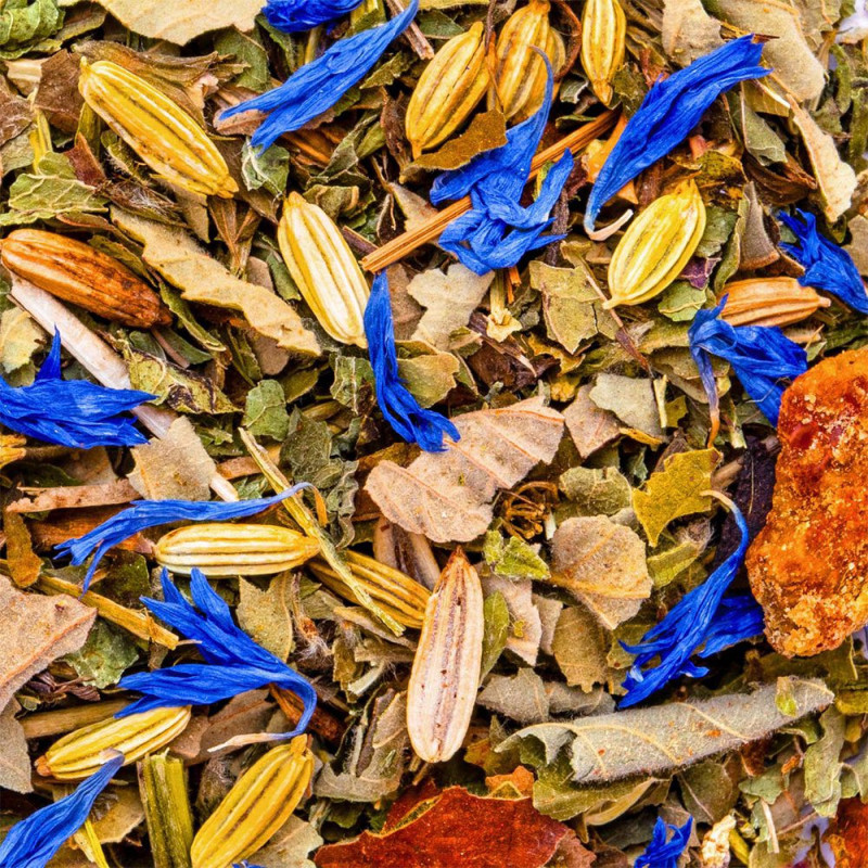 blend of dried plants with blue flowers seeds and bark for Ayurveda Kapha herbal tea
