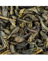 dried Chun Mee green tea leaves rolled and twisted with green and brown nuances