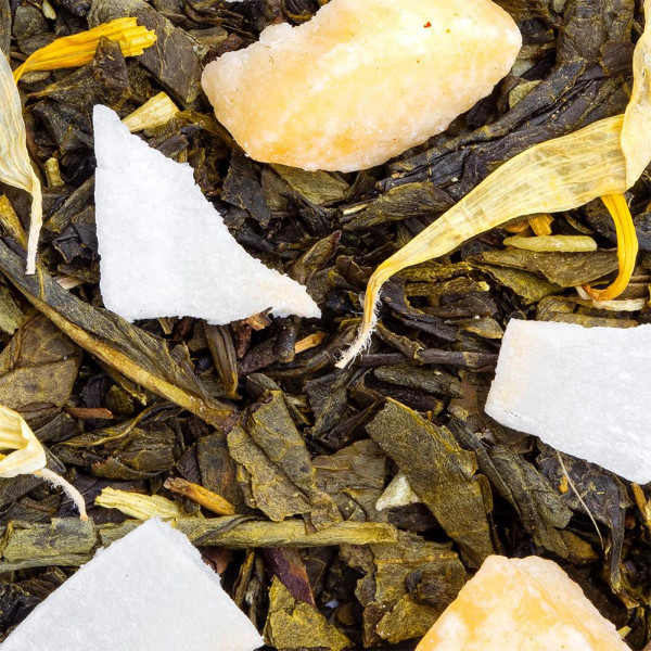 green tea with pineapple pieces and dried coconut with yellow petals