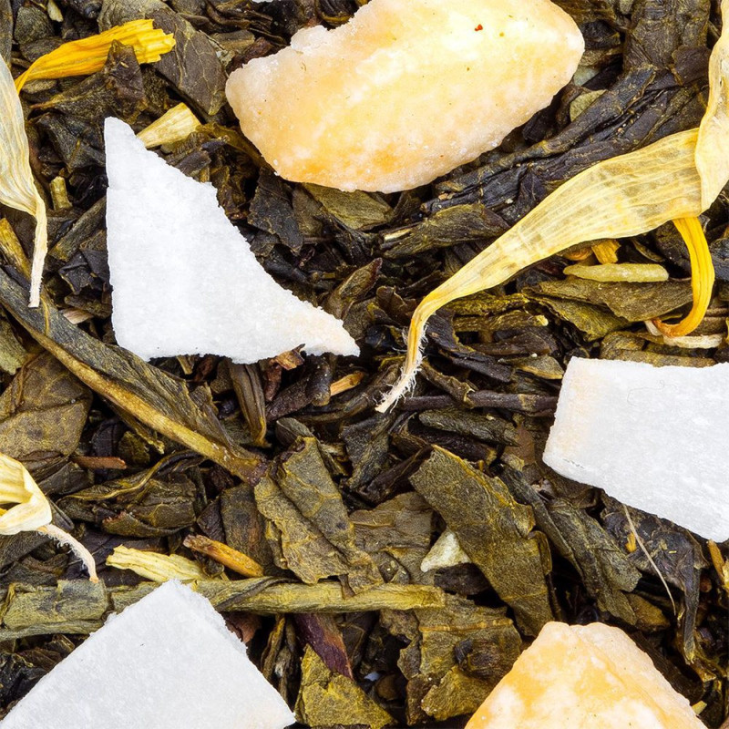 green tea with pineapple pieces and dried coconut with yellow petals