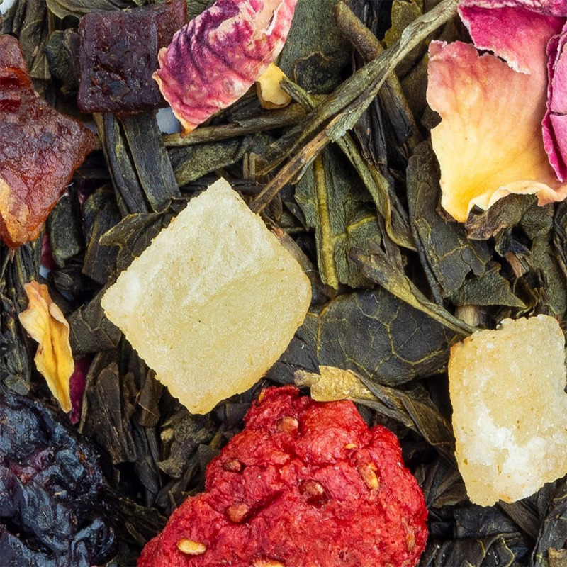 green tea blend with dried fruit pieces flower petals and tea leaves