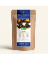 Wiederverschließbarer Kraftpapierbeutel mit Pu Erh Zimt Orange, dunkelblauem und goldenem Etikett von Thés & Traditions, Fenster