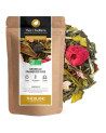 White tea with redcurrant raspberry rose in kraft bag with visible tea leaves and dried fruits