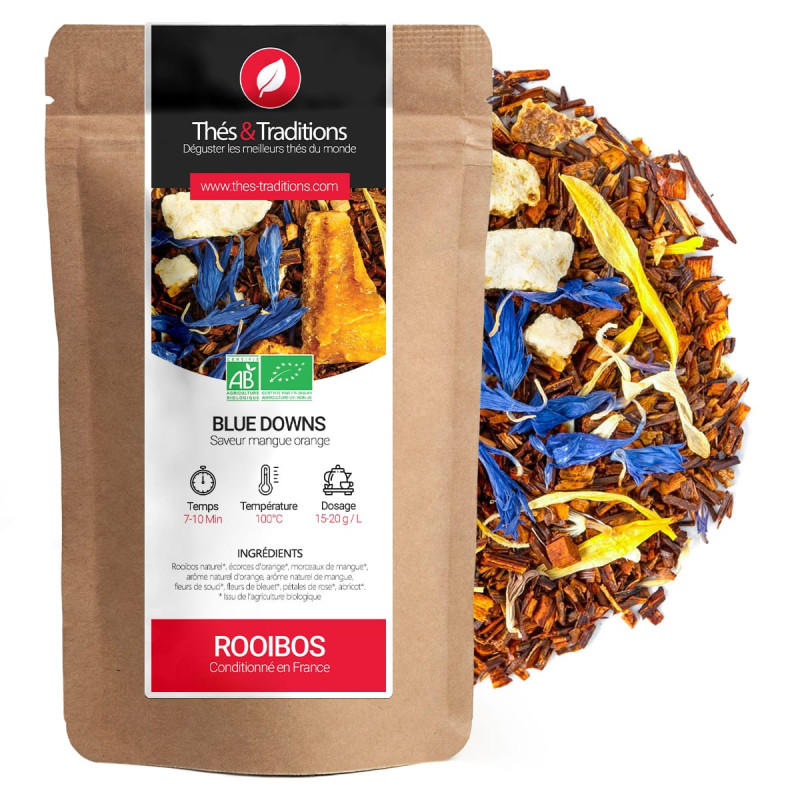 Rooibos Blue Downs smaak mango sinaasappel in kraft zakje met blauwe bloemen en stukjes biologisch fruit