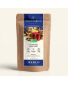 Verschließbarer Kraftpapierbeutel mit Rooibos Cranberry Ingwer, Etikett in Marineblau und Gold von Thés & Traditions, Fenster ze