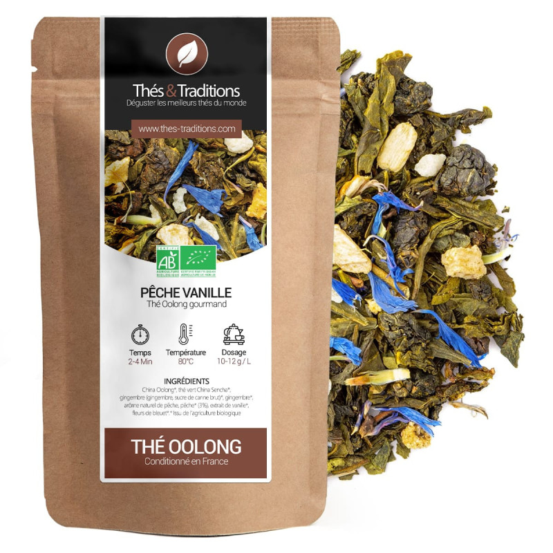 tè oolong pesca vaniglia bio in sacchetto kraft con foglie di tè ai fiori blu e pezzi di frutta secca