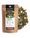 peach vanilla organic oolong tea in kraft bag with tea leaves with blue flowers and dried fruit pieces