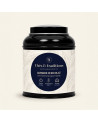 Runde schwarze Teedose mit Oolong Mandel Schokolade von Thés & Traditions, cremefarbenes Etikett mit Blattmuster und dunkelblaue