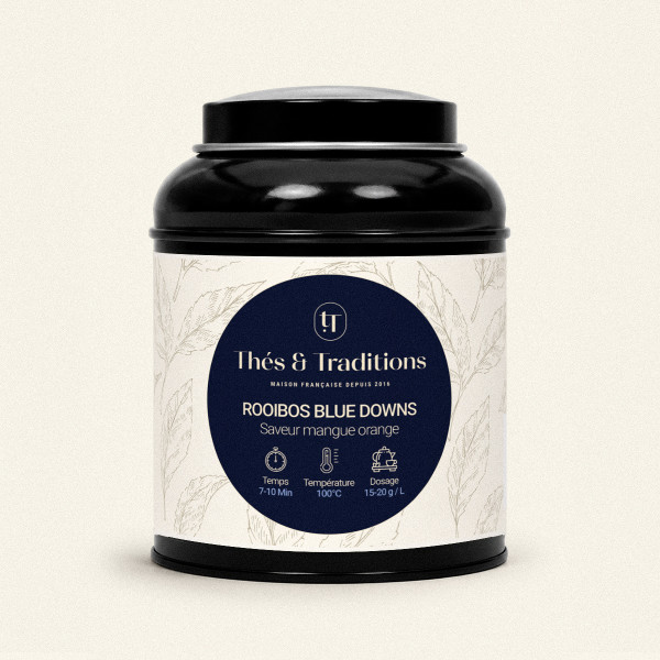 Round black tea tin of Rooibos Blue Downs Thés & Traditions, cream label with leaf pattern and navy and gold medallion