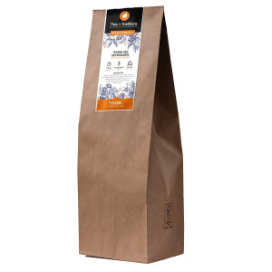 Bulk kilo bag of gourmet herbal tea from Thés et Traditions in kraft paper with white and orange label