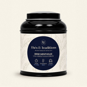 Runde schwarze Teedose mit Kräutertee Minzerbrise von Thés & Traditions, cremefarbenes Etikett mit Blattmotiv und dunkelblauem M