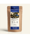 Wiederverschließbarer Kraftpapierbeutel mit grünem Tee Ginseng Ingwer, Etikett in Marineblau und Gold von Thés & Traditions, Fen