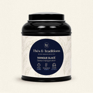 Runde schwarze Teedose mit Grüntee Mango Eiskalt von Thés & Traditions, cremefarbenes Etikett mit Blattmotiv und dunkelblauer Me