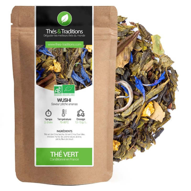 Thé Vert Wushi saveur pêche ananas sachet kraft et feuilles de thé aux fleurs bleues