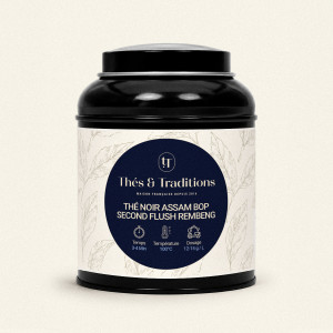 Schwarze runde Teedose mit Assam BOP Second Flush Rembeng Schwarztee von Thés & Traditions, cremefarbenes Etikett mit Blattmotiv