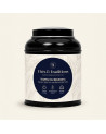 Runde schwarze Teedose von Schwarztee Temple du Bouddha von Thés & Traditions, cremefarbenes Etikett mit Blattmuster und blauem 