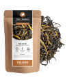 Yellow tea in long black and yellow leaves kraft packaging Thés et Traditions