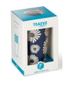 Amami blauwe thee-infuser met witte bloemen in kartonnen verpakking met transparant venster