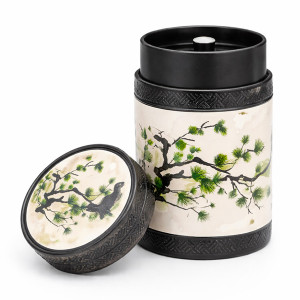 Akashi green tea caddy with pine branch and bird decoration with black lid adorned with engraved patterns