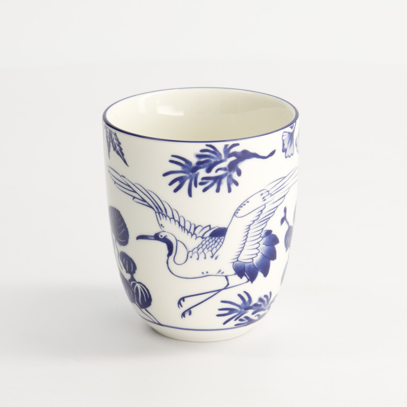 White porcelain cup decorated with a crane and blue floral motifs Japanese style