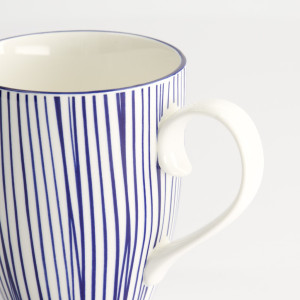 White porcelain mug with handles and thin vertical blue lines, Nippon Blue Lines design