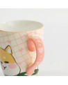 Ceramic mug with Shiba dog motif and pink handle decorated with small hearts