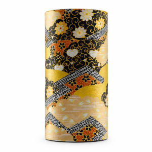 Cylindrical box with Japanese decor featuring golden, black and red floral patterns for tea