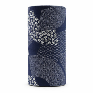Cylindrical washi paper box with white Japanese patterns on a navy blue background
