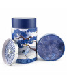 Round tea tin with blue crane and tree design, lid adorned with blue floral motifs