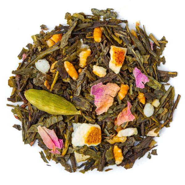 Blend of Sencha Genmaicha green tea with pistachio, rose petals, cardamom and orange pieces, overhead view