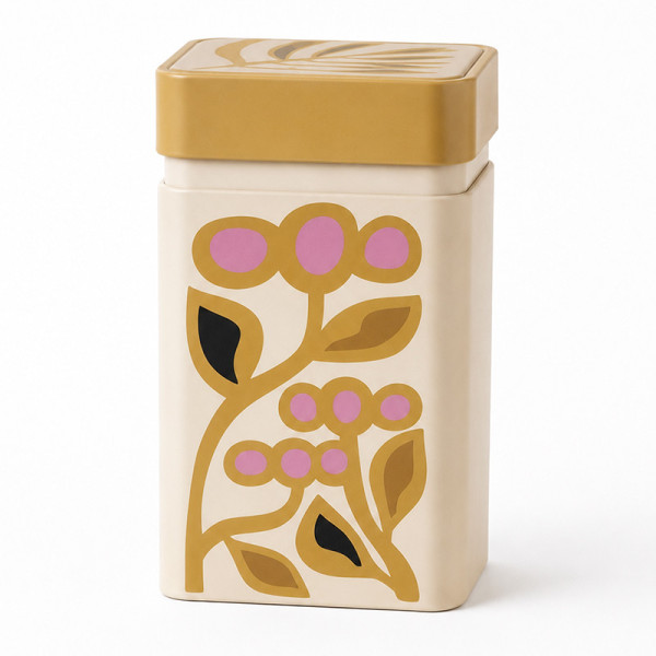 boîte à thé jaune avec motif floral stylisé rose et feuilles marron et noir