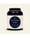 Lattina rotonda nera di Camomilla Thés & Traditions, etichetta crema con motivo di foglie e medaglione blu navy e oro